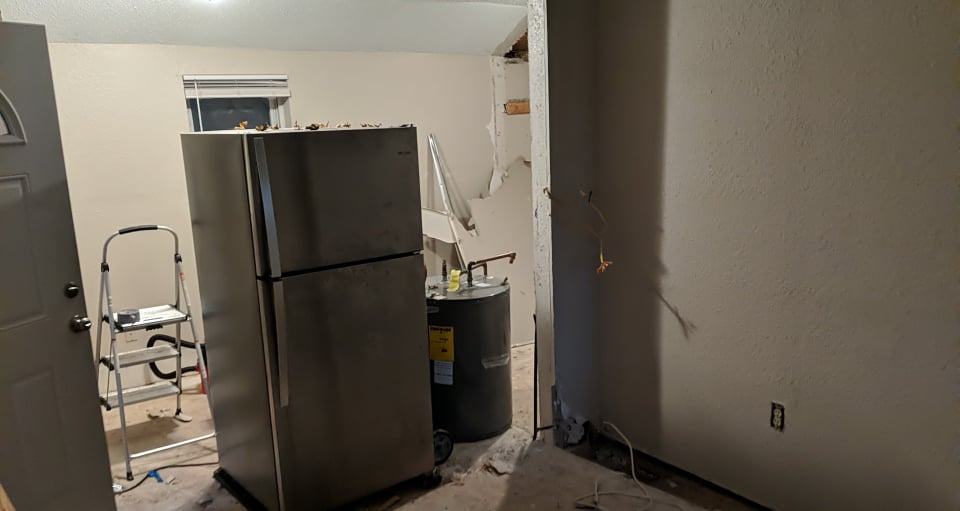 Tore Down the Bedroom wall and sold the fridge for 50 bucks.